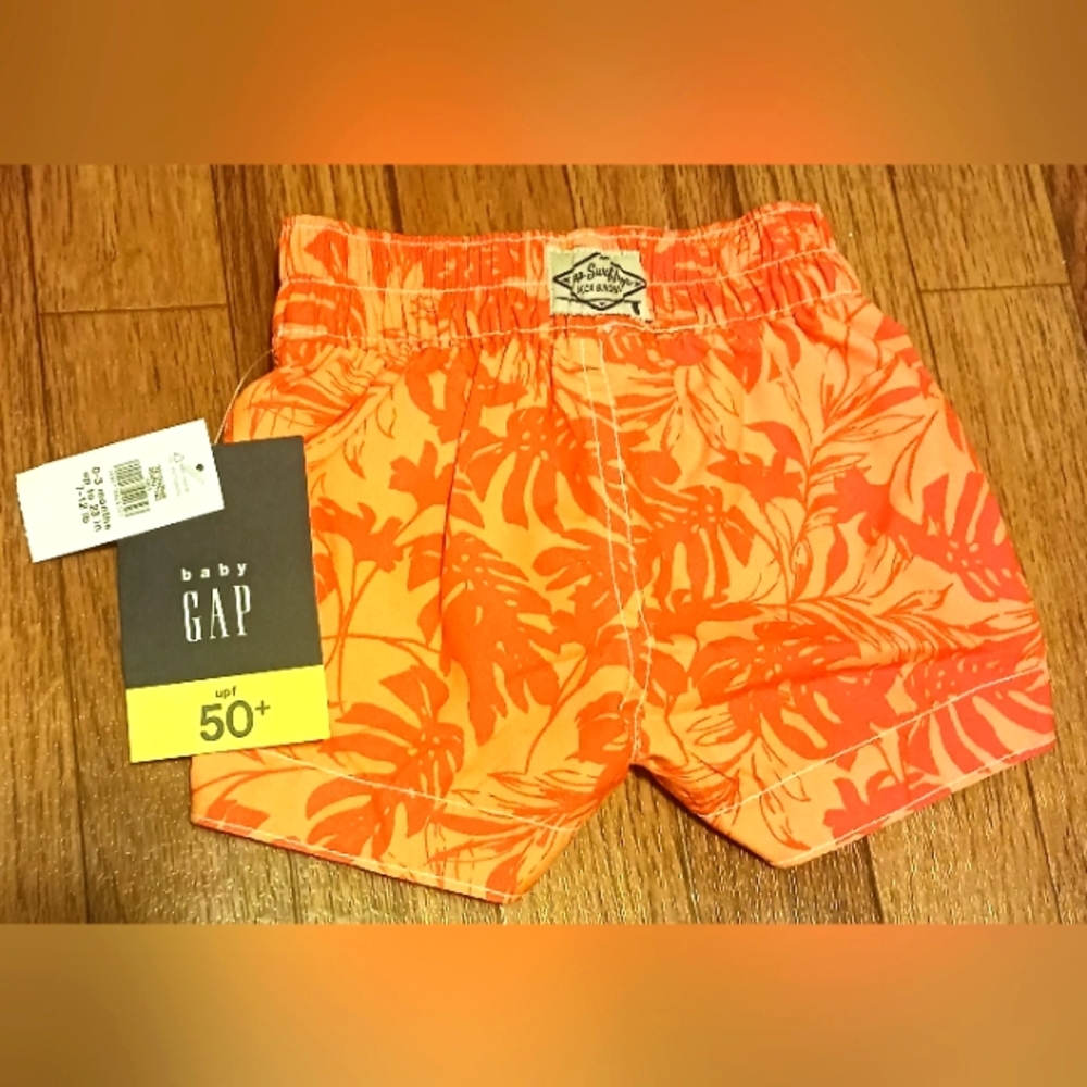 Orange baby boy swim shorts Sz 0-3 months nwt